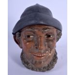 AN ANTIQUE AUSTRIAN TOBACCO JAR AND COVER in the form of a fisherman. 15 cm high.