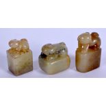 THREE EARLY 20TH CENTURY CHINESE CARVED GREEN JADE SEALS Late Qing. Largest 4.5 cm x 3 cm. (3)