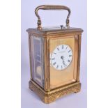 A 19TH CENTURY FRENCH BRASS REPEATING CARRIAGE CLOCK retailed by Langford & Sons of Bristol. 17 cm h