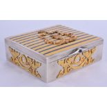 A CONTINENTAL TIGERS EYE ENAMELLED SILVER BOX decorated in raised silver gilt with helmets and folia