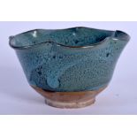 A 19TH CENTURY CHINESE ROBINS EGG GLAZED STONEWARE PETAL BOWL Late Qing. 8.5 cm wide.