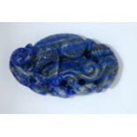 A carved Lapis Lazuli bolder in the form of a monkey 6cm.