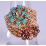 A 14CT GOLD TURQUOISE AND RUBY RING. 10 grams. K/L.