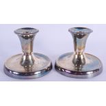 A PAIR OF SCANDINAVIAN DAVID ANDERSON SILVER CANDLESTICKS. 507 grams overall. 8 cm high.