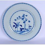A LARGE 18TH CENTURY CHINESE BLUE AND WHITE PORCELAIN DISH Yongzheng/Qianlong, painted with a fenced