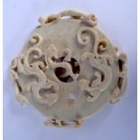 A LARGE 19TH CENTURY CHINESE CARVED JADE BI DISC Qing, decorated with chilong dragons. 25 cm wide.