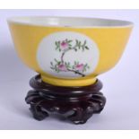 A CHINESE FAMILLE ROSE SCRAFITO PORCELAIN BOWL 20th Century, painted with peaches. 11 cm wide.