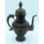 A bronze lidded dragon handled Tibetan oil ewer 38 x 28 cm.
