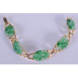 AN EARLY 20TH CENTURY CHINESE 14CT GOLD MOUNTED JADEITE BRACELET. 25 grams. 16.5 cm long.