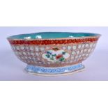 A 19TH CENTURY CHINESE FAMILLE ROSE LOBED BOWL painted with flowers. 18 cm x 15 cm.