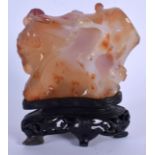 A 19TH CENTURY CHINESE CARVED AGATE BOULDER Late Qing, decorated with figures. Agate 8 cm x 9.5 cm.