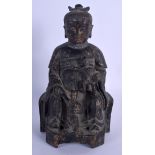 A CHINESE FIGURE OF A SEATED BUDDHA modelled with two attendants. 25 cm high.