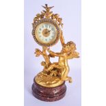 A 19TH CENTURY FRENCH GILT BRONZE FIGURE OF A PUTTI modelled holding aloft a diamante encrusted dial