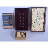 A VINTAGE CHINESE CASED MAHJONG SET with book. (qty)