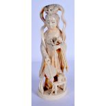 A 19TH CENTURY JAPANESE MEIJI PERIOD CARVED IVORY OKIMONO modelled holding a fan. 21 cm high.