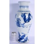 A LARGE 19TH CENTURY CHINESE BLUE AND WHITE BALUSTER VASE Kangxi style, painted with warriors within
