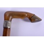 A 19TH CENTURY CARVED RHINOCEROS HORN HORSE HOOF WALKING CANE. 86 cm long.