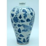 A Chinese Blue and White Meiping vase decorated with a phoenix and foliage 30cm .