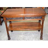 A Edwards and Roberts two drawer carved entrance table. 107 x 79 cm.