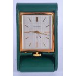 A RETRO JAEGER LE COULTRE LEATHER CASED TRAVELLING CLOCK. 5.5 cm square.