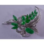 AN 18CT GOLD DIAMOND AND JADE BROOCH of floral form. 16 grams. 6 cm x 5 cm.