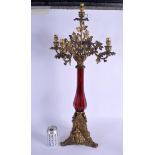 A VERY RARE 19TH CENTURY RUBY GLASS BRONZE MOUNTED CANDELABRA decorated with figures within building