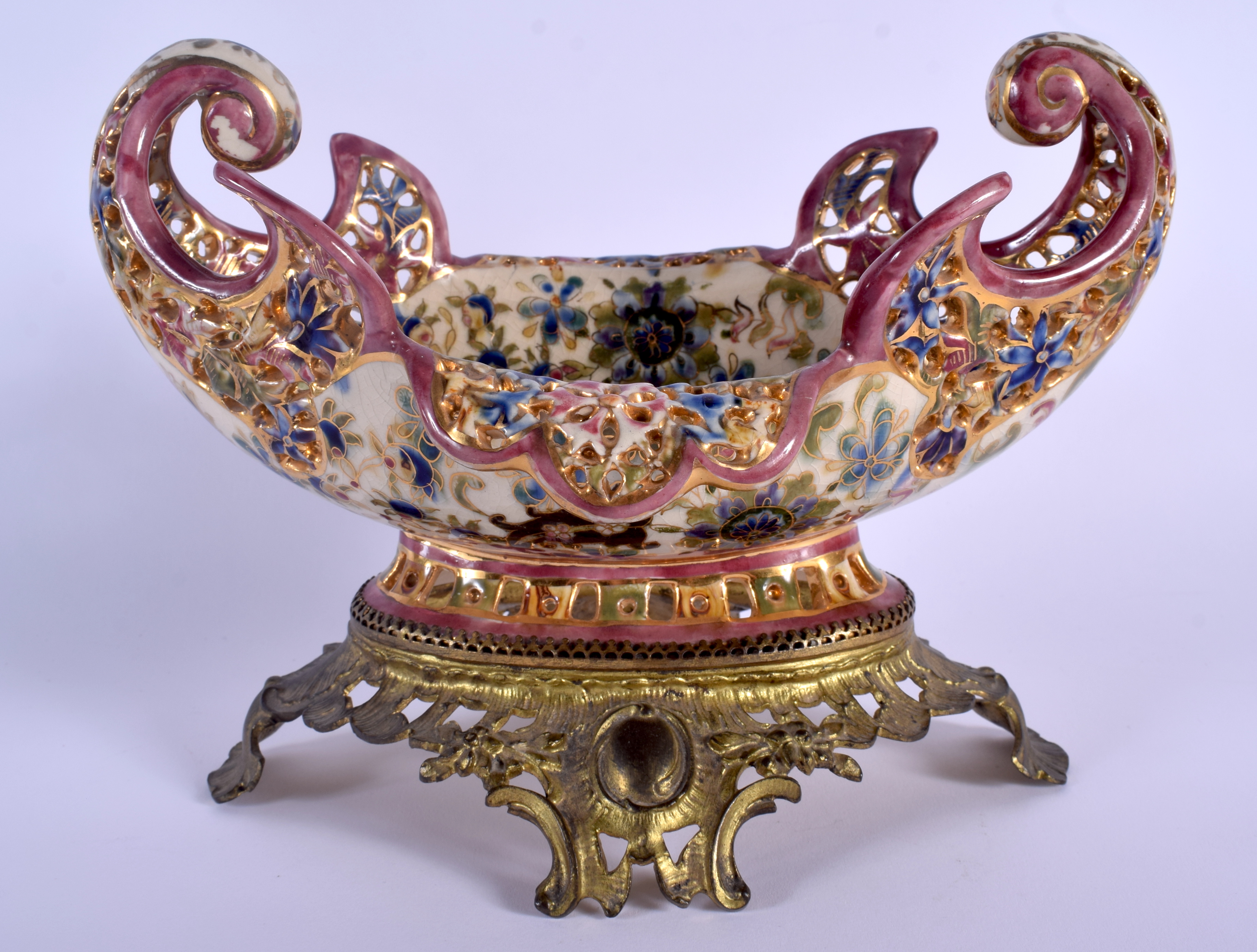 A 19TH CENTURY HUNGARIAN FISCHER POTTERY BOWL upon a gilt metal base. 24 cm x 18 cm.