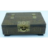 A wooden Chinese box with brass fittings and a fish lock and a calligraphy paper lining 32 x 22cm