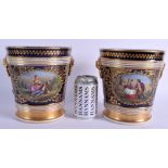A LARGE PAIR OF 19TH CENTURY FRENCH PORCELAIN CACHE POTS painted with romantic scenes upon a rich bl
