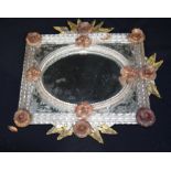 A glass framed mirror decorated with flowers and leaves 42 x 42cm .