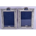 A PAIR OF SILVER PHOTOGRAPH FRAMES. 20 cm x 17 cm.