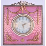 AN UNUSUAL CONTINENTAL SILVER GILT GEM SET PINK ENAMEL DESK CLOCK modelled with a seed pearl banded