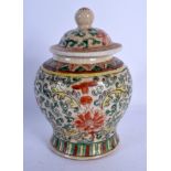 A 19TH CENTURY CHINESE FAMILLE VERTE VASE AND COVER bearing Kangxi marks to base. 17 cm high.