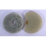 TWO EARLY 20TH CENTURY CHINESE CARVED JADE PLAQUES Late Qing. 5 cm diameter. (2)