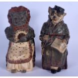 A PAIR OF ANTIQUE AUSTRIAN TOBACCO JAR AND COVER in the form of a dog and cat. 19 cm high.
