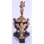 A 19TH CENTURY FRENCH BRASS MOUNTED GRAND TOUR ORNAMENT modelled with a putti. 24 cm long.