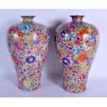 A PAIR OF CHINESE FAMILLE ROSE BALUSTER PORCELAIN VASES 20th Century, painted with flowers. 38 cm hi