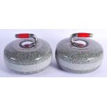 A PAIR OF BAKELITE HANDLED GRANITE CURLING STONES. 25 cm x 21 cm.