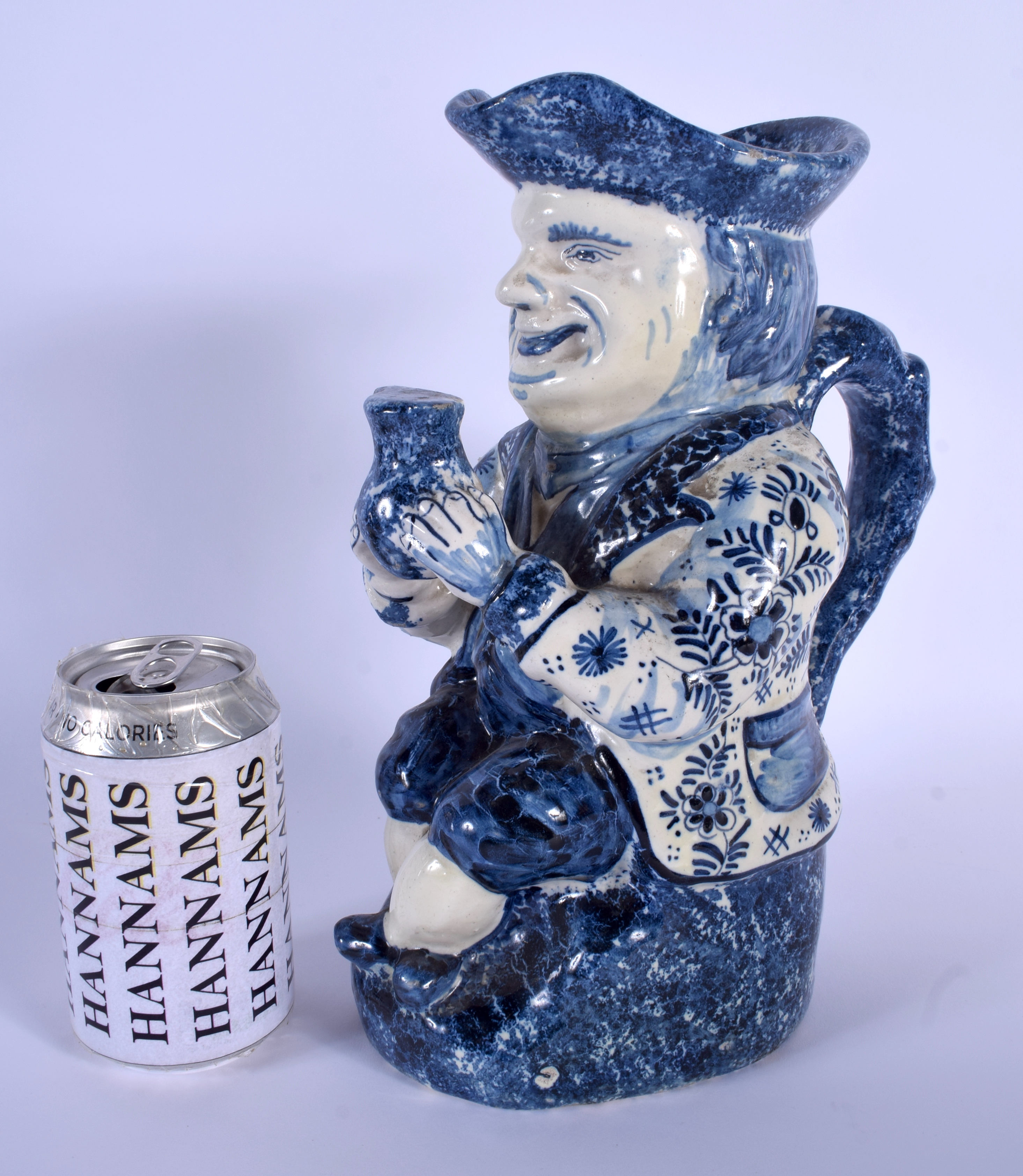 AN ANTIQUE DUTCH BLUE AND WHITE DELFT POTTERY TOBY JUG modelled as a male holding an ale jug. 27 cm