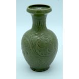 A Chinese green glazed vase with a floral pattern 24 x 13cm.