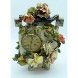 A large continental ceramic flower encrusted Henry Marc clock .