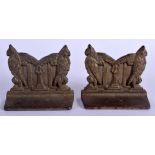 A PAIR OF ARTS AND CRAFTS BRONZE BOOK ENDS. 12 cm x 9 cm.