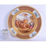 A LARGE 19TH CENTURY VIENNA PORCELAIN CIRCULAR DISH painted with classical scenes within a landscape
