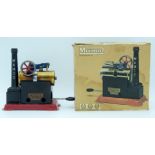 A vintage boxed Mamod model steam engine .