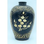 A song style Cizhou ware vase decorated with black ground and Ivory flowers. 29cm.