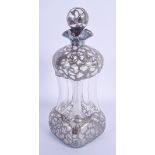 AN ART NOUVEAU SILVER OVERLAID DECANTER AND STOPPER. 25 cm high.