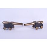 AN UNUSUAL PAIR OF ANTIQUE BRONZE CANNONS. 18 cm long.
