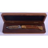 A BOXED SCHRADER NORTH AMERICAN FISHING CLUB KNIFE. Box 25 cm wide.