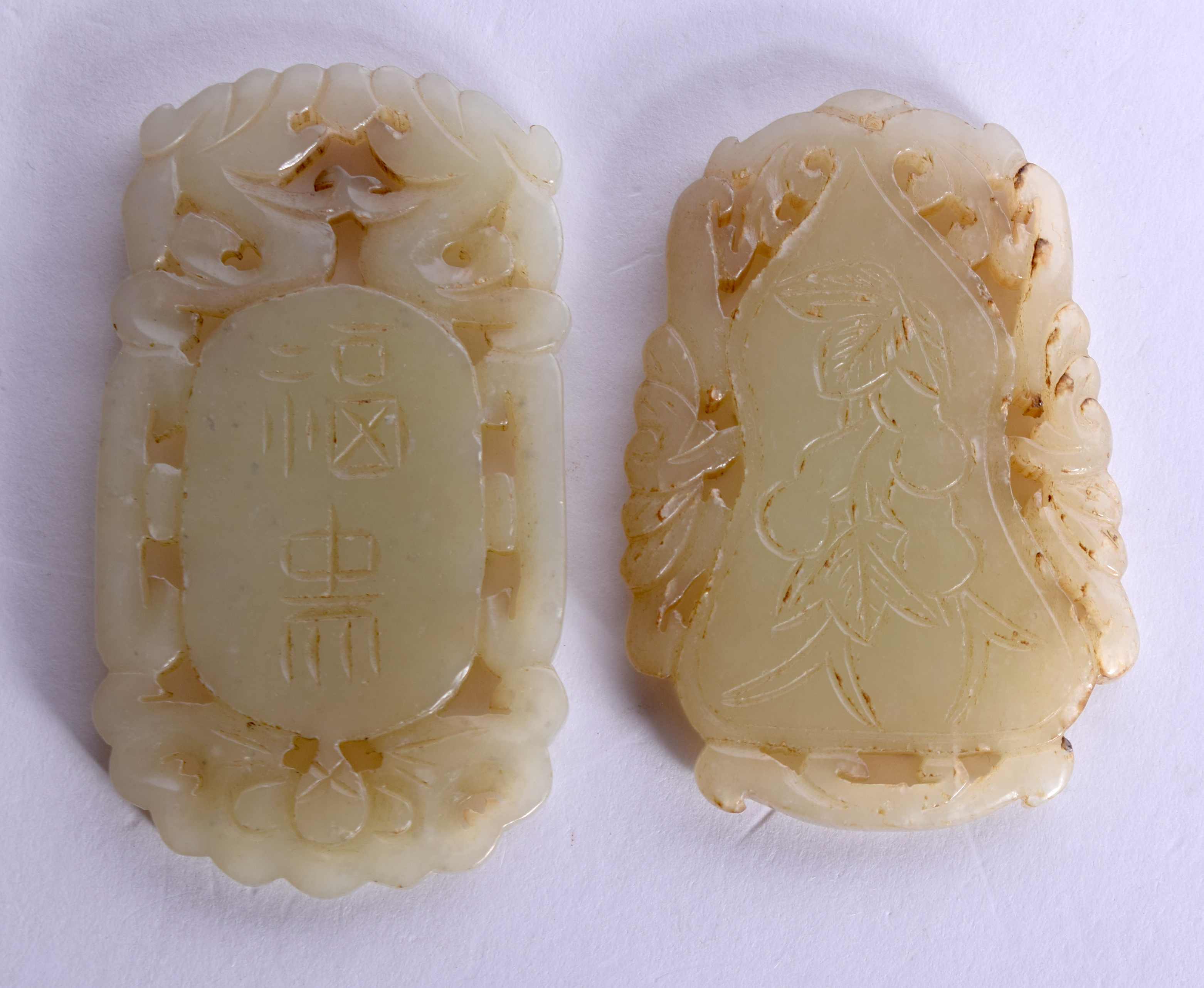 TWO EARLY 20TH CENTURY CHINESE CARVED JADE PLAQUES Late Qing. 5 cm diameter. (2) - Image 2 of 2
