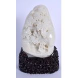 A LARGE 1960S CHINESE CARVED WHITE JADE MOUNTAIN decorated with figures under flowering pine. Jade 2